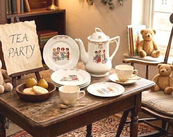 May include: A white porcelain tea set comprising a teapot, cups, saucers, and plates adorned with colourful illustrations of children. A wooden bowl contains two pears and two biscuits. A sign on an easel displays the text TEA PARTY.