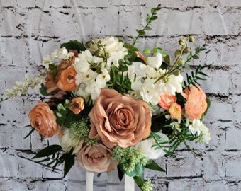 Boho brides wedding bouquet in ivory, terracotta, orange and dusty peach. Real touch eucalyptus and ferns.