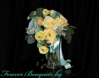 Teardrop wedding bouquet in soft yellows and light aqua pool blue. Cabbage roses hydrangeas, calla lilies, ranunculus and garden Rose's.