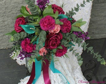 Brides bouquet with Sangeria Canations and roses, Purple lilacs and teal calla lilies. pink rose buds with eucalyptus and greenery.