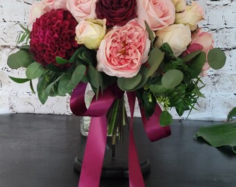 Wide Brides wedding bouquet in berry, pinks and blush. Loaded with greenery