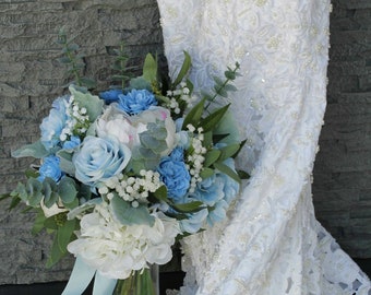 Shades of blue and White brides bouquet with peonies, roses, ranuculus and hydrangeas. Dusty Mille and Eucalyptus.
