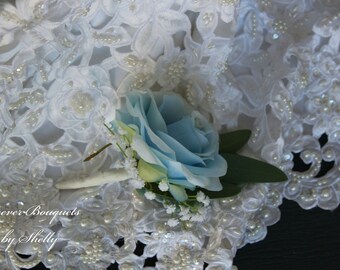 Wedding or Prom Boutonniere Light Blue rose with baby breath. Wrist Corsage would be light blue rose, white tea roses and baby's breath