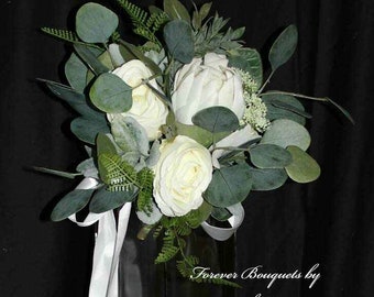 Bridesmaids Boho wedding Protea bouquet with white roses, eucalyptus, lambs ear, ruscus and ferns.