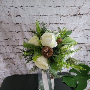 Winter Boho bouquet with White roses, and pine cones, evergreen and eucalyptus and dusty miller. image 3