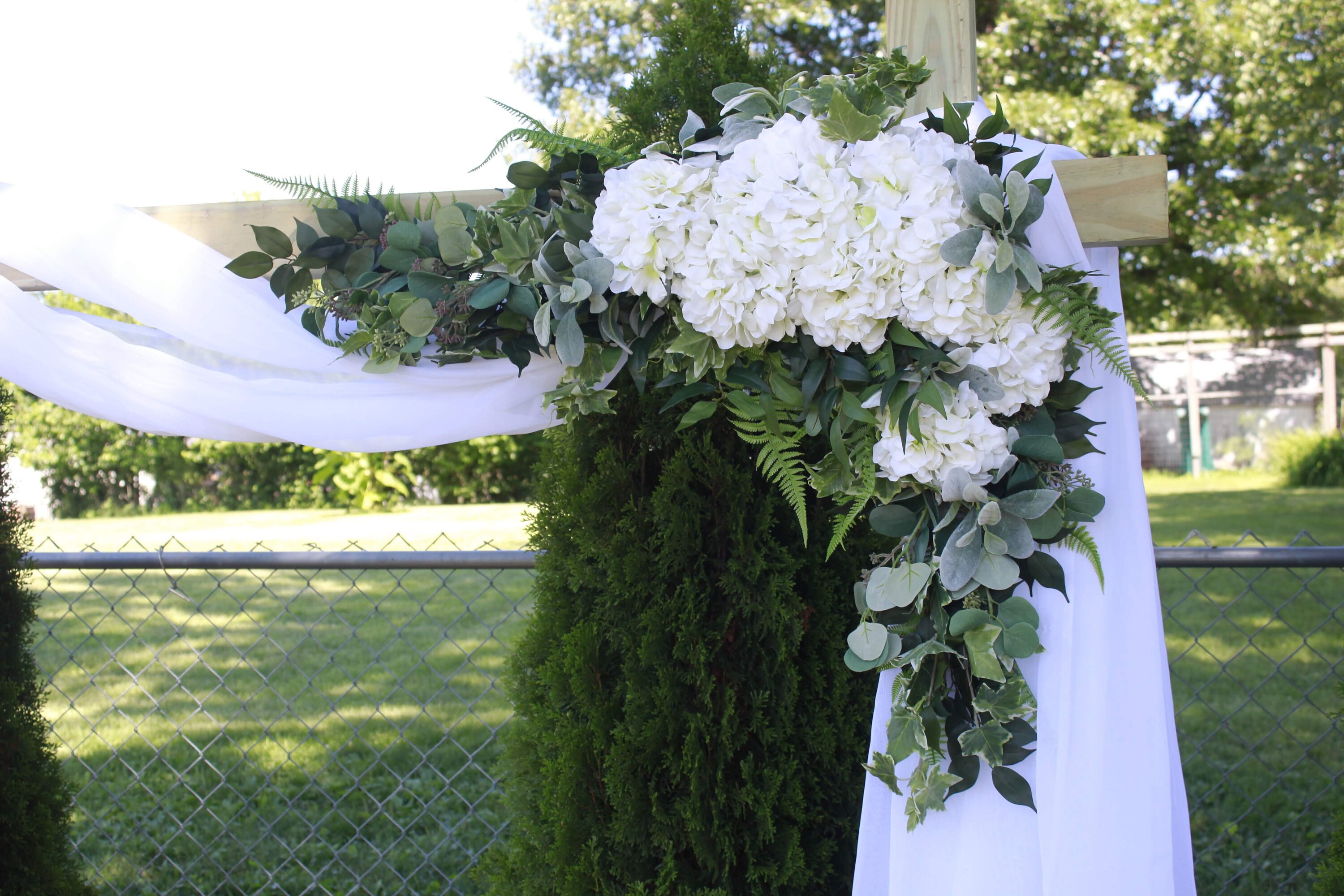 botanical swag wild flowerＡ Wildflower Wedding Arch Flowers with Sunflowers & Jasmine
