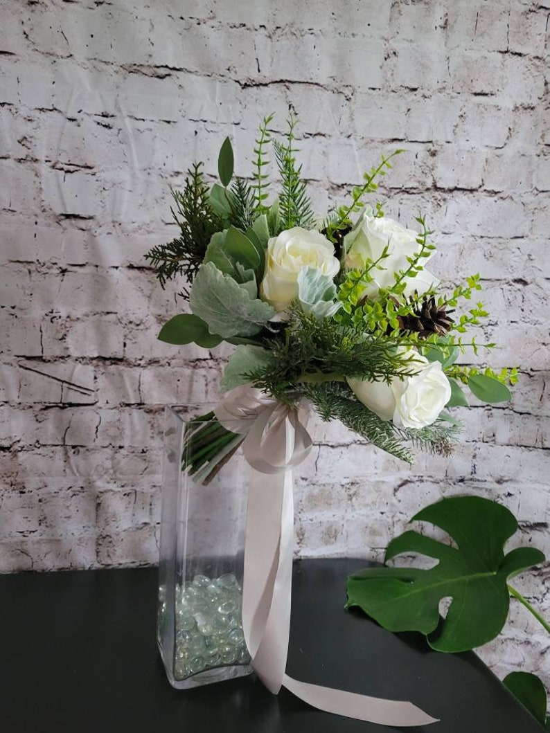 Winter Boho bouquet with White roses, and pine cones, evergreen and eucalyptus and dusty miller. image 2