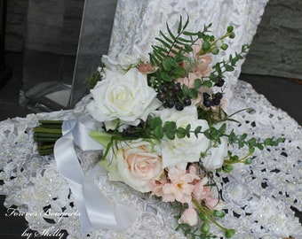 Boho wedding bouquet with blush delphiniums, tri-tone blush ivory and white roses ferns, eucalyptus, navy blue berry, straw flower