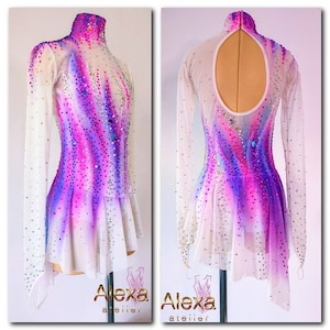 May include: White figure skating dress with long sleeves and a high neck. The dress has a pink and purple ombre design with rhinestones. The back of the dress has a keyhole opening.