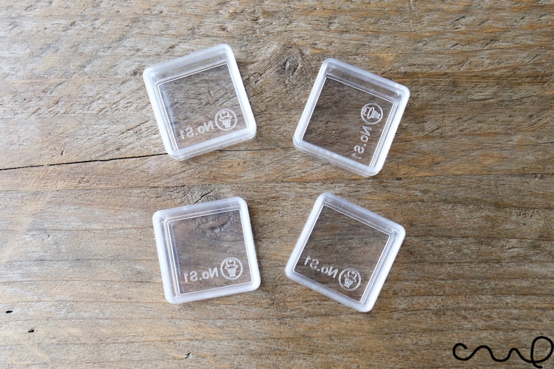 May include: Four clear plastic square containers with the text "No.1" printed on each container.