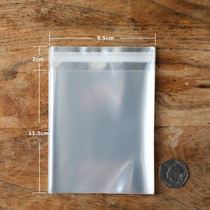 透明ビニール袋 セロハン OPPビニール袋 粘着式ディスプレイ用 剥がしてシールできる袋 9 x 14 cm 高品質 40ミクロン厚 10/50/100枚入り