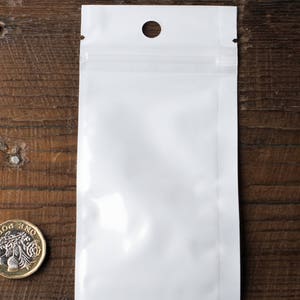 Sachets refermables : devant transparent, dos blanc - Emballages pour bijoux et créations artisanales
