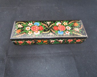 May include: A black wooden box with a floral design painted on the lid and sides. The flowers are red, pink, white, blue, and green.