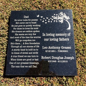 May include: Black granite memorial stone with a poem about a father and a tree with butterflies flying away. The stone has the names Leo Anthony Grasso, 6/13/1951 - 7/29/2001 and Robert Douglas Joseph, 6/5/1948 - 6/11/2015.