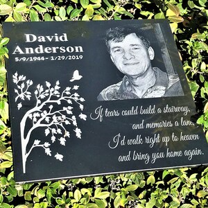 May include: Black granite memorial plaque with a white tree design, a photo of a man, and the text "David Anderson 5/9/1944-1/29/2019". The plaque also includes a poem: "If tears could build a stairway, and memories a lane, I'd walk right up to heaven and bring you home again."