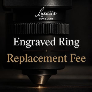 May include: A black laser engraving machine head with a pointed nozzle emitting a thin beam of light. The text Luxuria JEWELERS, Engraved Ring, and Replacement Fee is displayed in white and gold lettering against the dark machinery background.