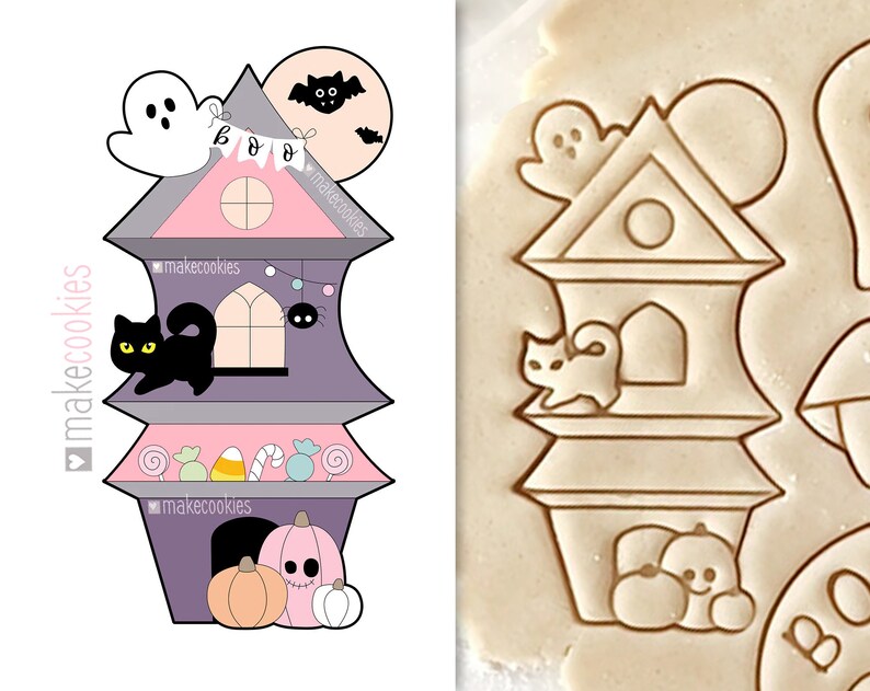 May include: A Halloween-themed cookie cutter in the shape of a haunted house. The house is purple, pink, and gray, with a black cat, ghost, and pumpkins. The word "BOO" is on a banner. The cookie cutter is for making Halloween treats.