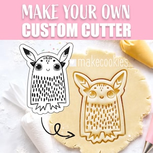 May include: A cookie cutter in the shape of a cartoon creature with large eyes, ears, and a dotted body. The image also shows the cutter's impression in dough, along with the text "MAKE YOUR OWN CUSTOM CUTTER".