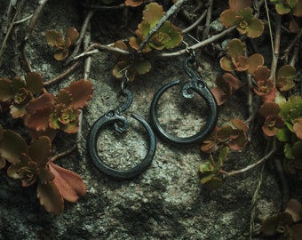 Jormungandr the Midgard serpent. World serpent earrings,  an ouroboros