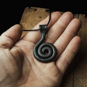 forged viking sun pendant, sun spiral or solsnurra a symbol for the sun