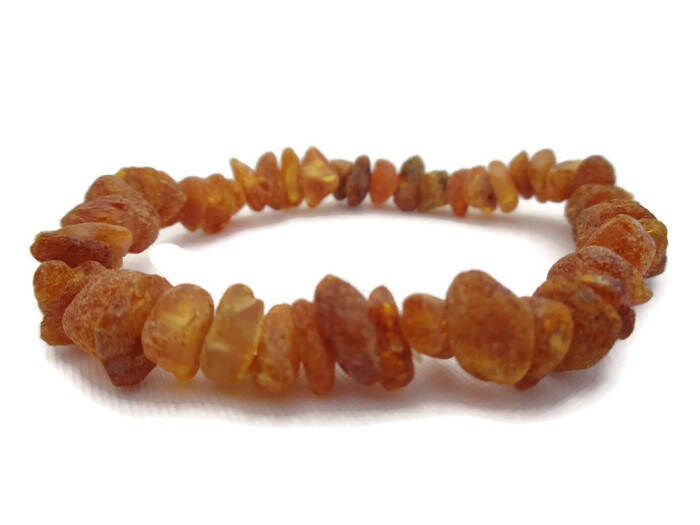 amber necklace on ankle