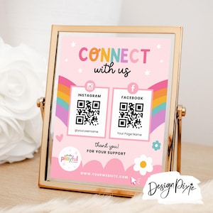 May include: A pink and rainbow-themed sign with the text "CONNECT with us" and QR codes for Instagram and Facebook. The sign also includes the text "thank you! FOR YOUR SUPPORT" and a website address.