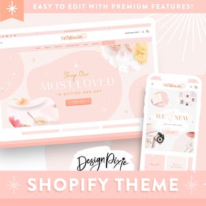 May include: A pink Shopify theme design shown on a laptop and smartphone. The laptop screen displays a website with the text "Shop Our Most Loved In Gifting and Art." The smartphone shows a website with the text "We New." The design includes the text "Easy to Edit with Premium Features!"