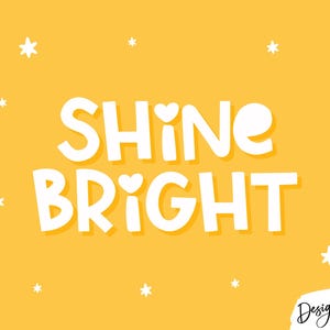 May include: A bright yellow graphic print featuring the white text SHINE BRIGHT with small heart accents on the letters I. The design is decorated with various white star shapes scattered across the background and includes the text Design Pixie.