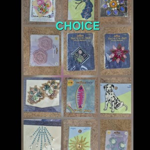 May include: A collection of iron-on patches and appliques, including floral designs, a peacock, a dalmatian, and a sunburst. The word "CHOICE" is displayed in green. These patches are ideal for adding decorative elements to clothing and accessories.