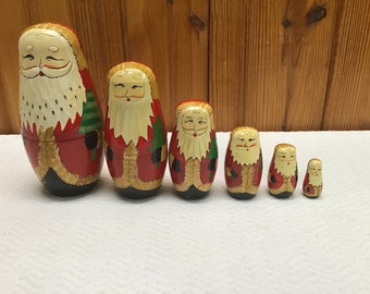 Vintage set of 6 Russian? Hand Painted Santa Claus Nesting Eggs Nesters