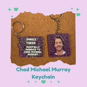 May include: Two purple glitter keychains. One keychain has the text "Single, Taken, Mentally Married to Chad Michael Murray". The other keychain has a photo of Chad Michael Murray. Both keychains have silver key rings.