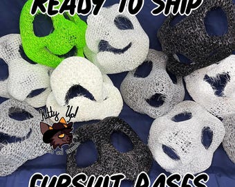May include: A collection of 3D printed mesh fursuit head bases in neon green, white, and black. The text READY TO SHIP and FURSUIT BASES is overlaid on the image, along with a logo featuring a cat character and the text Kitty Up! Fursuits and Mascots.