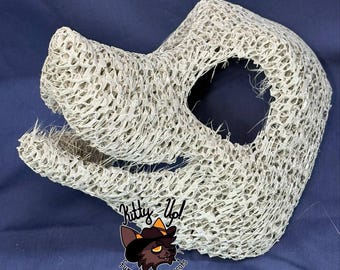 May include: A beige, open-mesh animal head base for a costume, featuring a snout and a large eye opening. The structure has a textured, grid-like appearance. A logo with the text Kitty Up! fursuits and mascots is visible at the bottom.