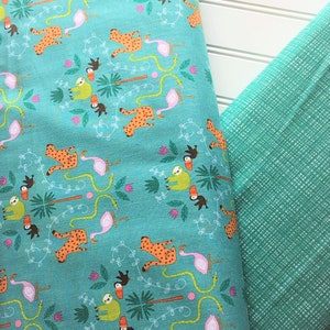 May include: Two pieces of fabric, one with a turquoise background and a repeating pattern of sloths, toucans, snakes, jaguars, and pink flamingos, and the other a solid turquoise with a subtle textured pattern.