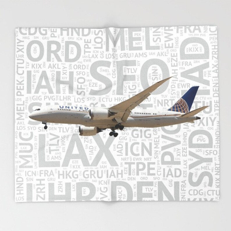 United Airlines 787 with Airport Codes Throw Blanket