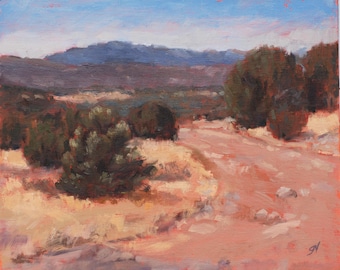 May include: A painting of a dirt road winding through a desert landscape. The road leads to a mountain range in the distance. There are bushes and trees on either side of the road.
