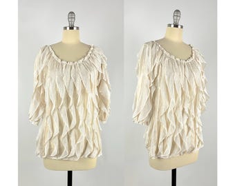 Vintage-Bluse aus elfenbeinfarbenem, cremeweißem Strick mit Rüschen, transparent, ungefüttert, 3/4-Ärmeln, Größen S bis M, 90er-Jahre, leicht, romantisch.