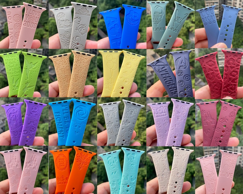 May include: A collection of 20 colorful silicone watch bands with various designs and text. The bands are all for Apple Watches and feature different patterns and phrases.