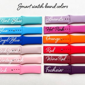 May include: A set of ten silicone watch bands in various colors, including mint blue, blue, royal blue, pink sand, vintage pink, pink, lavender, hot pink, orange, red, wine red, and fuchsia. The bands are arranged in two rows of five, with the color names printed on each band.