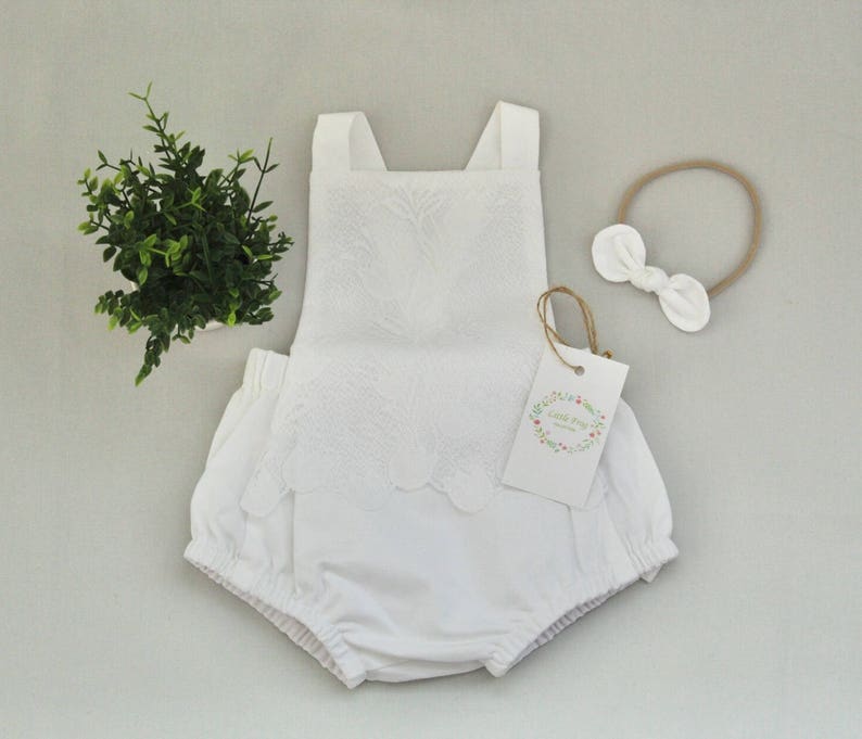 white newborn romper