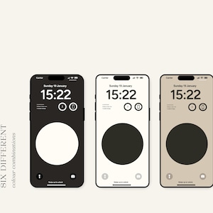 Op de afbeelding: Zes verschillende telefoon-schermdesigns met een grote cirkel in het midden. De cirkels zijn wit, zwart, donkergrijs, lichtgrijs, blauw en beige. Alle telefoonschermen tonen de datum en tijd, "zondag 19 januari" en "15:22".