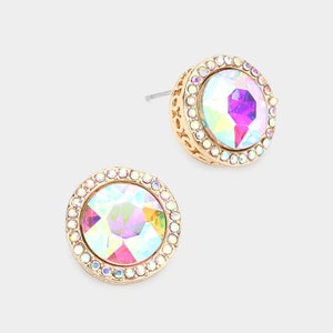 May include: A pair of gold-tone earrings with iridescent round stones set in a clear crystal halo.