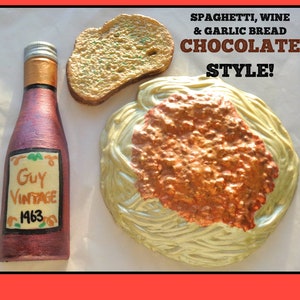 May include: A chocolate replica of a spaghetti and meatballs dinner with a bottle of wine and a piece of garlic bread. The bottle is labelled "Guy Vintage 1963". The text "Spaghetti, Wine & Garlic Bread Chocolate Style!" is written above the food.