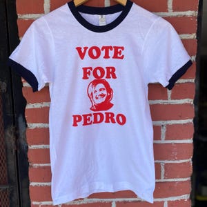 Vote For Pedro Pascal Screen Printed White Unisex  Ringer T Shirt