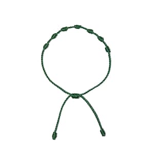 May include: A dark green adjustable bracelet featuring a series of knots along the main band. The bracelet has a sliding knot closure for a customizable fit. The design is simple and minimalist, suitable for everyday wear.