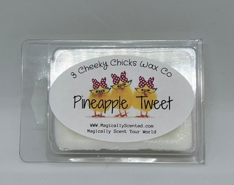 May include: A white wax melt in a clear plastic container with a label that says "3 Cheeky Chicks Wax Co. Pineapple Tweet" and "www.MagicallyScented.com Magically Scent Your World".