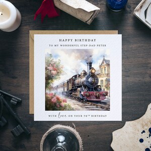 May include: A birthday card with a watercolor illustration of a vintage steam train traveling through a lush green landscape. The card has the text "Happy Birthday to my wonderful step-dad Peter with love on your 70th birthday."