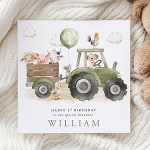 May include: A green tractor with a number one balloon attached to the side.  The tractor is carrying a variety of farm animals, including a pig, cow, sheep, mouse, and dog.  The text on the card reads "Happy 1st Birthday to our special Grandson WILLIAM".