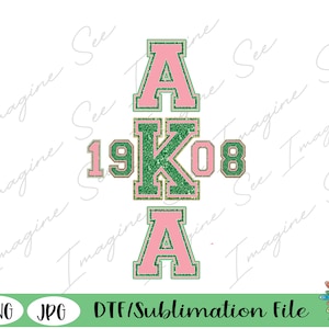 May include: A pink and green glitter design with the letters "AKA" and the numbers "1908" in a varsity style font. The design is suitable for use on apparel, mugs, or other items.