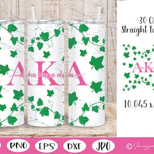 May include: A 30-ounce straight tumbler with a white background and a design of green ivy leaves and the letters "AKA" in pink. The letters stand for Alpha Kappa Alpha, a historically Black sorority.
